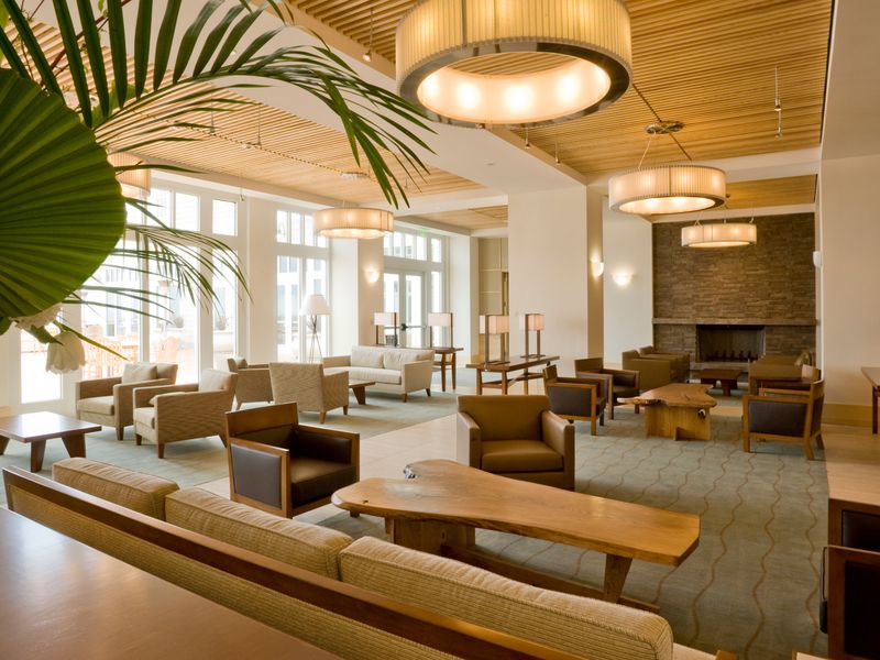 Hotel lobby lounge with seating and warm lighting